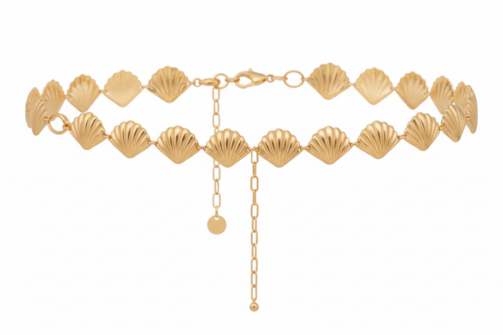 A gold-tone scallop shell waist chain 